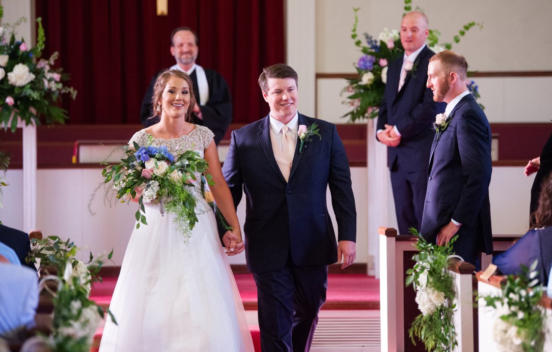 The Columns in Bolivar & Falcon Ridge Farm Wedding walking out