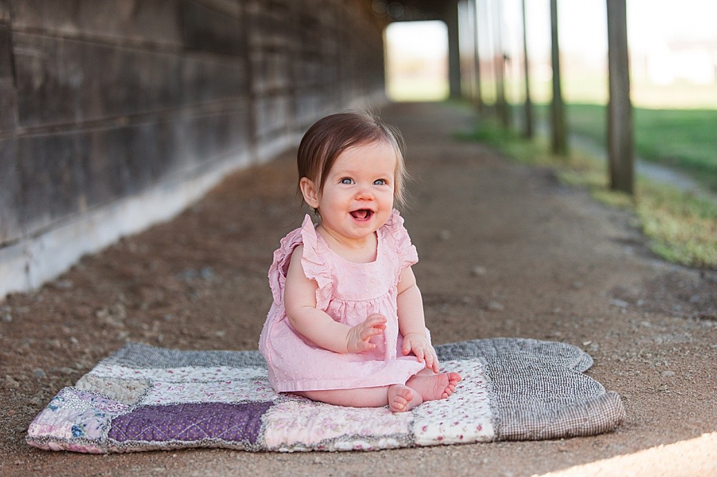baby in pink dress